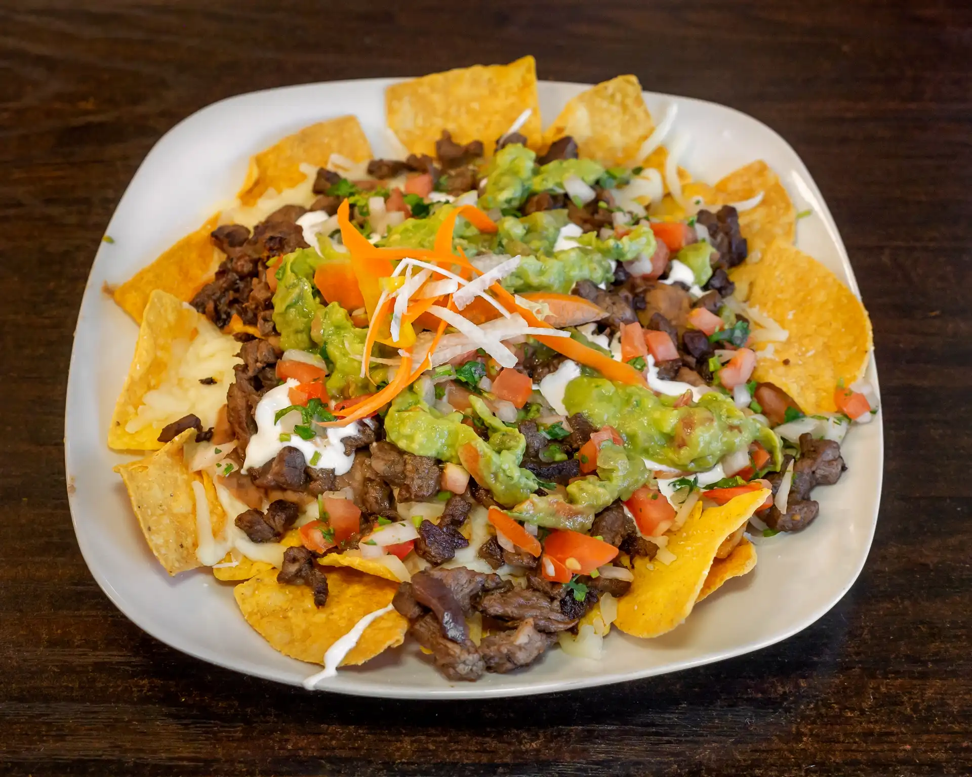 Nachos - Loaded nachos with cheese and toppings.